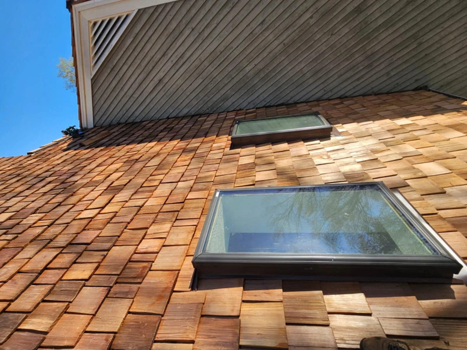 Cedar shake siding and skylight flashing detail