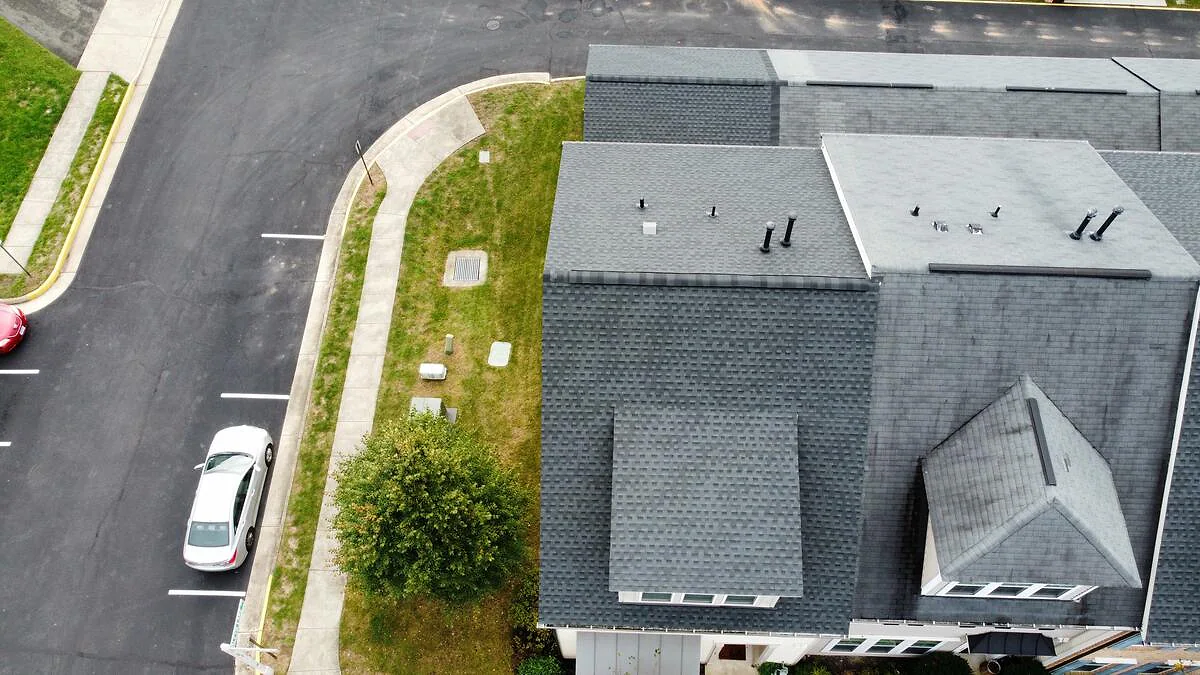 Completed residential roof system with clean ridge and valley lines