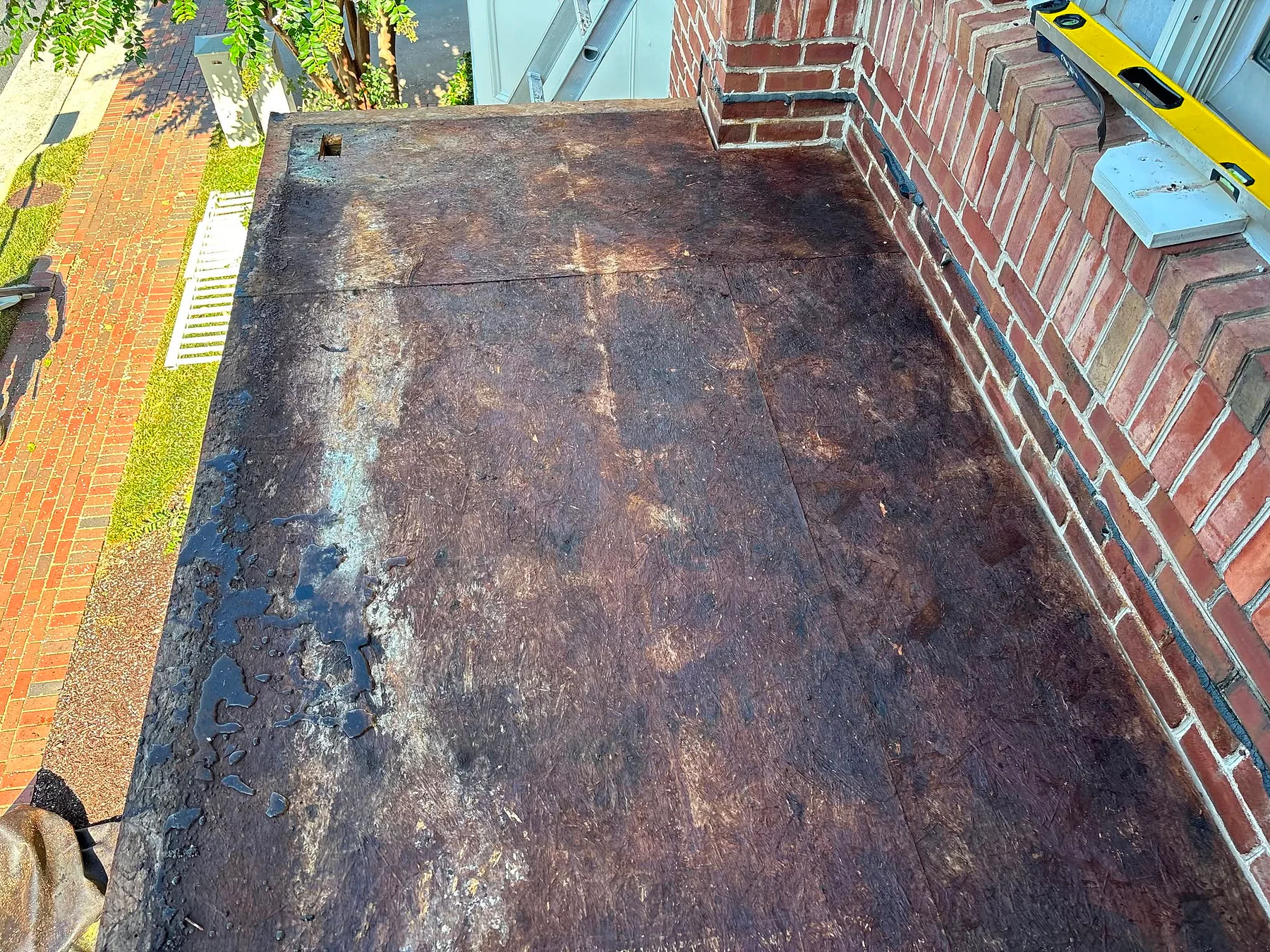 Damaged low-slope roof deck before KKC repair work