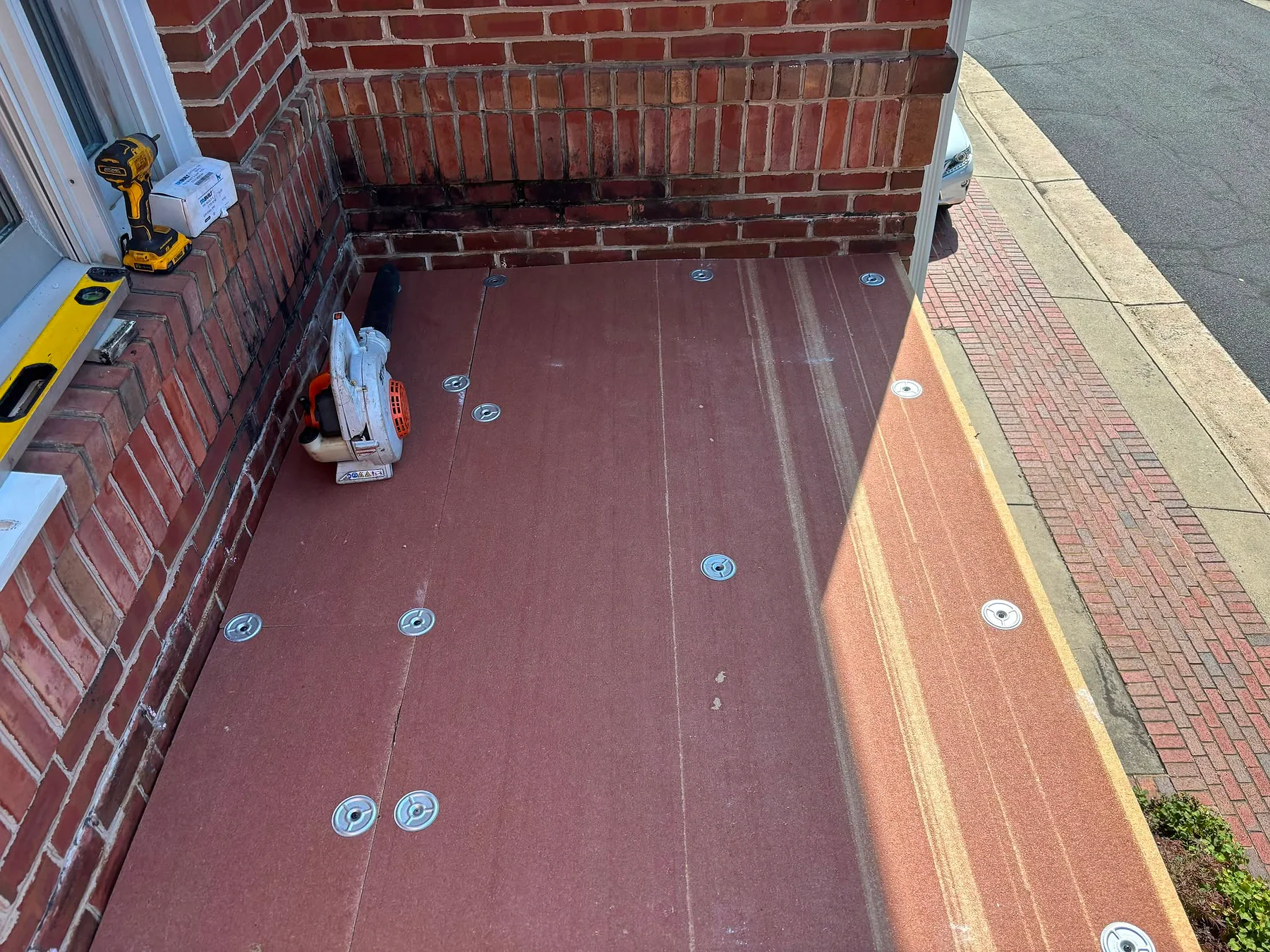 Fastened substrate prepared for a low-slope roofing membrane