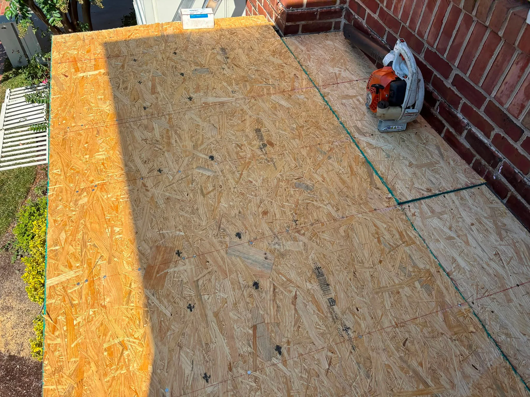 New roof decking installed during a low-slope roof restoration