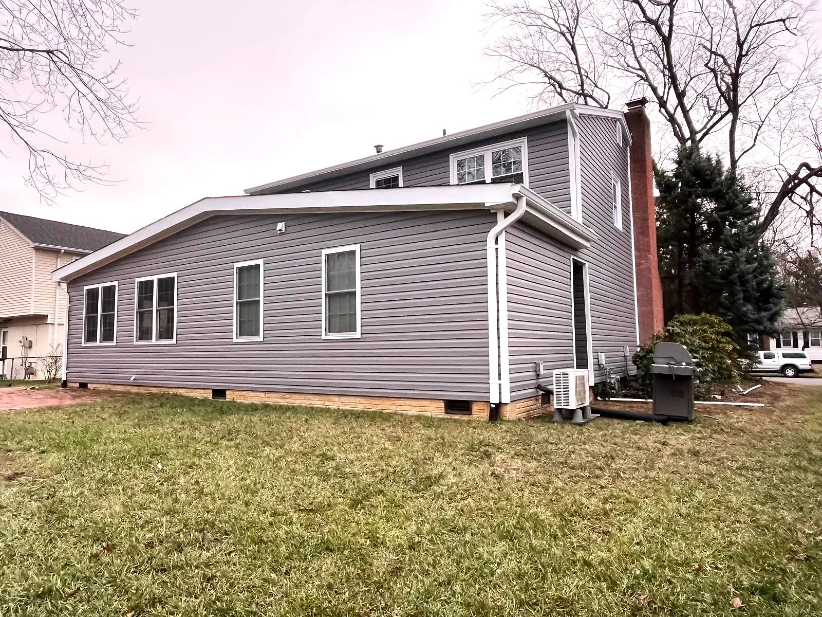 Completed white gutter system and exterior trim